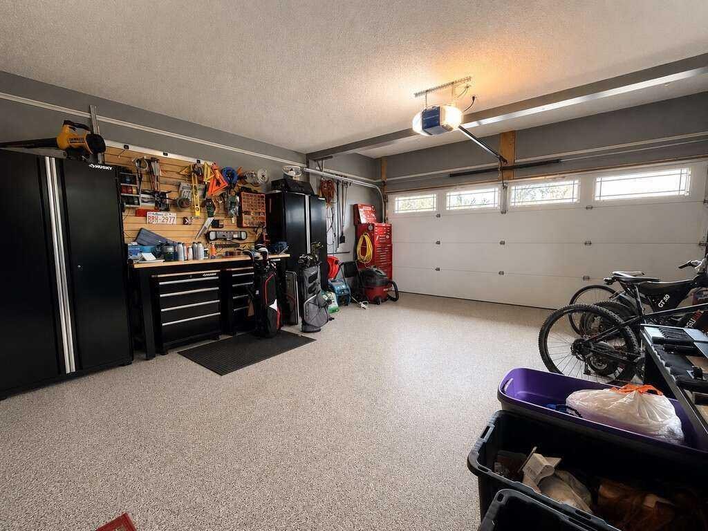 24 Brander Avenue Nw, Langdon, AB - Indoor Photo Showing Garage