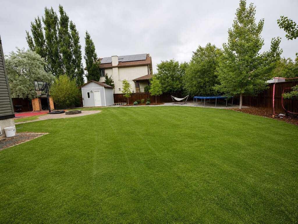 24 Brander Avenue Nw, Langdon, AB - Outdoor With Backyard
