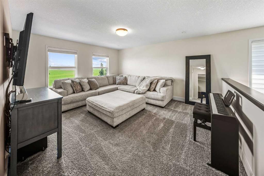 110 Kinniburgh Road, Chestermere, AB - Indoor Photo Showing Living Room