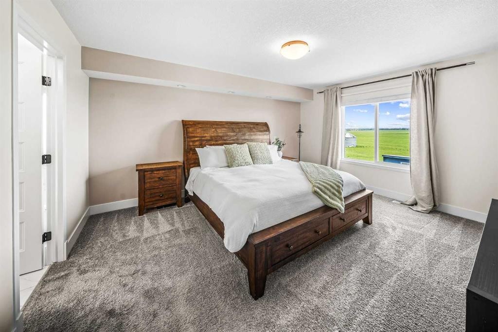 110 Kinniburgh Road, Chestermere, AB - Indoor Photo Showing Bedroom