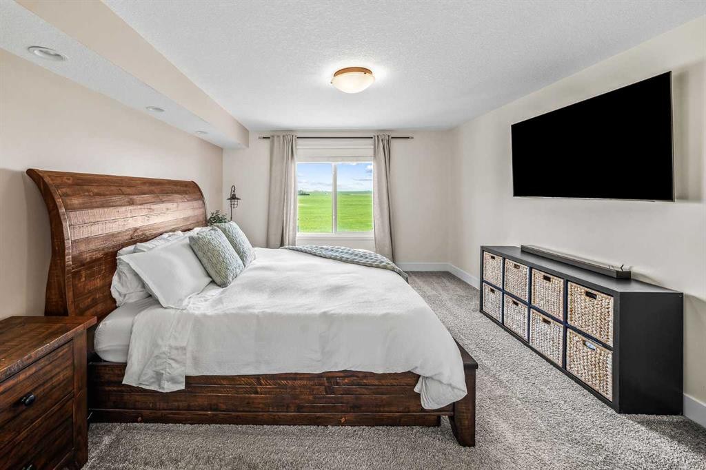110 Kinniburgh Road, Chestermere, AB - Indoor Photo Showing Bedroom