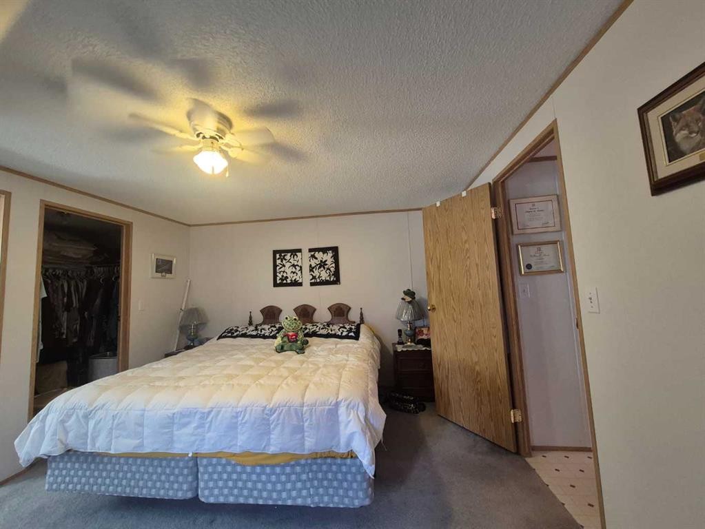 34280 Range Road 41, Rural Mountain View County, AB - Indoor Photo Showing Bedroom