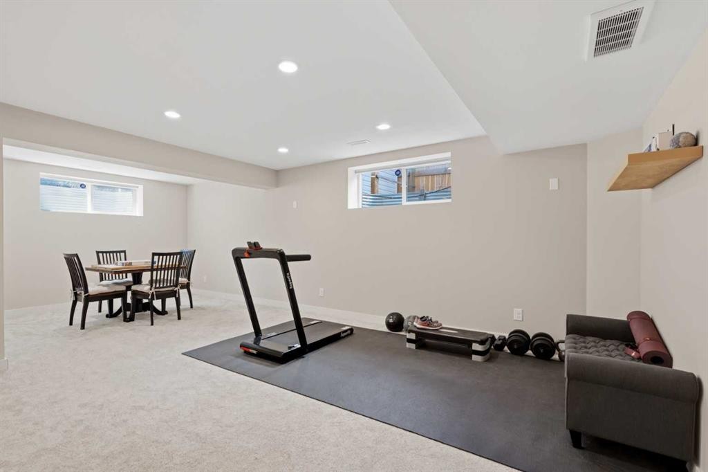 82 Brightonwoods Green Se, Calgary, AB - Indoor Photo Showing Gym Room
