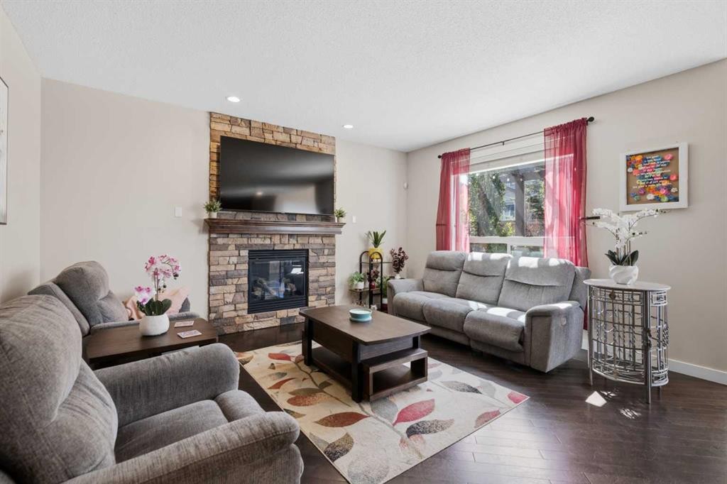 82 Brightonwoods Green Se, Calgary, AB - Indoor Photo Showing Living Room With Fireplace