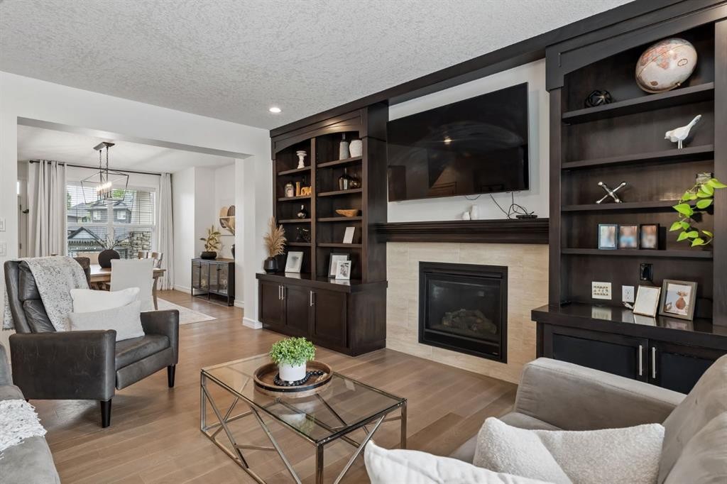 46 Aspenshire Place Sw, Calgary, AB - Indoor Photo Showing Living Room With Fireplace