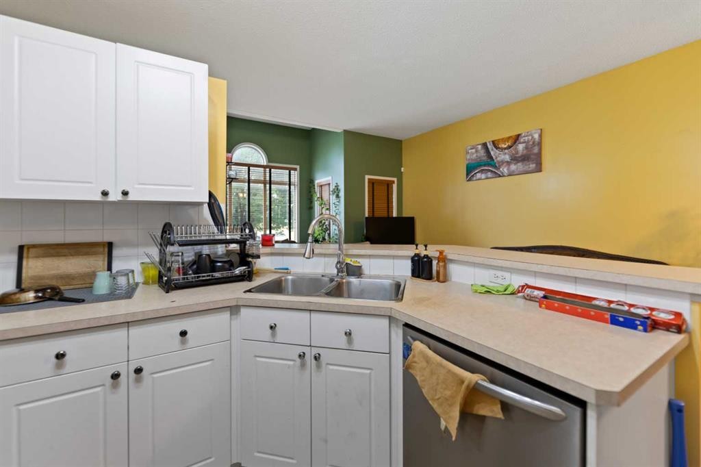 5036 Martin Crossing Drive Ne, Calgary, AB - Indoor Photo Showing Kitchen With Double Sink