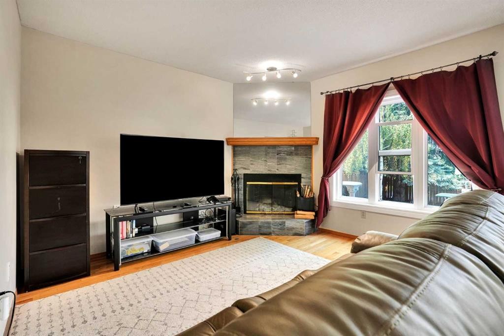 16 Sun Harbour Crescent Se, Calgary, AB - Indoor Photo Showing Living Room With Fireplace