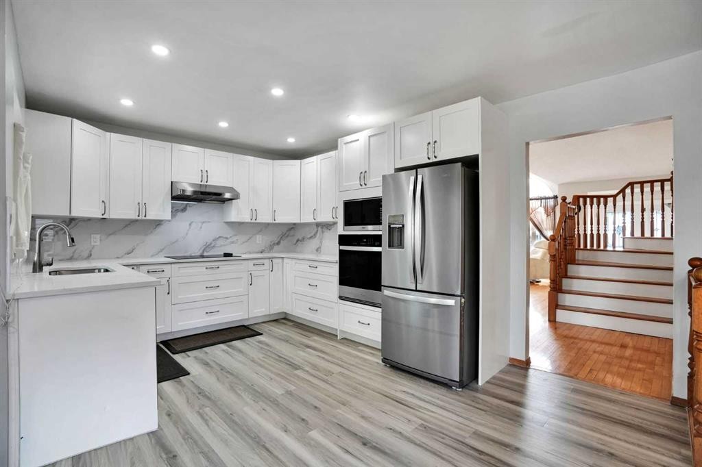 16 Sun Harbour Crescent Se, Calgary, AB - Indoor Photo Showing Kitchen With Stainless Steel Kitchen