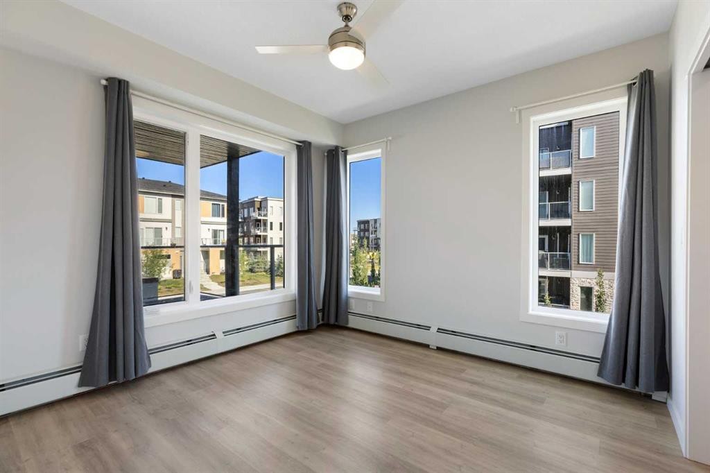202-150 Shawnee Square Sw, Calgary, AB - Indoor Photo Showing Other Room