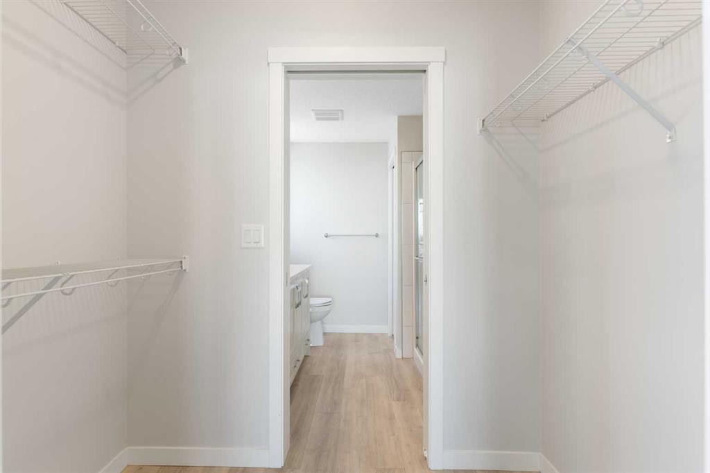 202-150 Shawnee Square Sw, Calgary, AB - Indoor With Storage