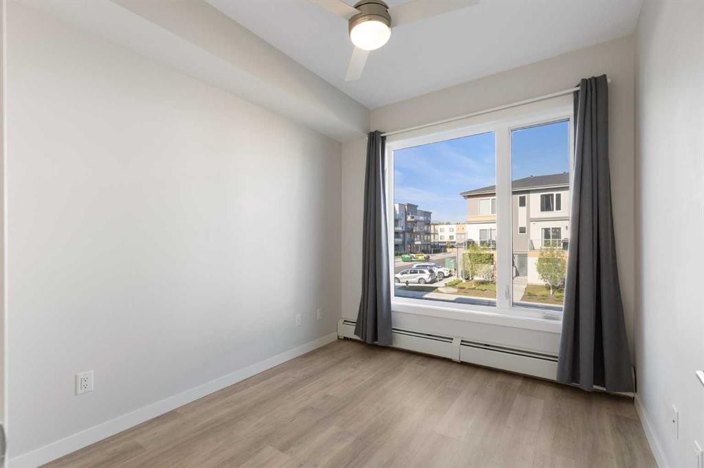 202-150 Shawnee Square Sw, Calgary, AB - Indoor Photo Showing Other Room