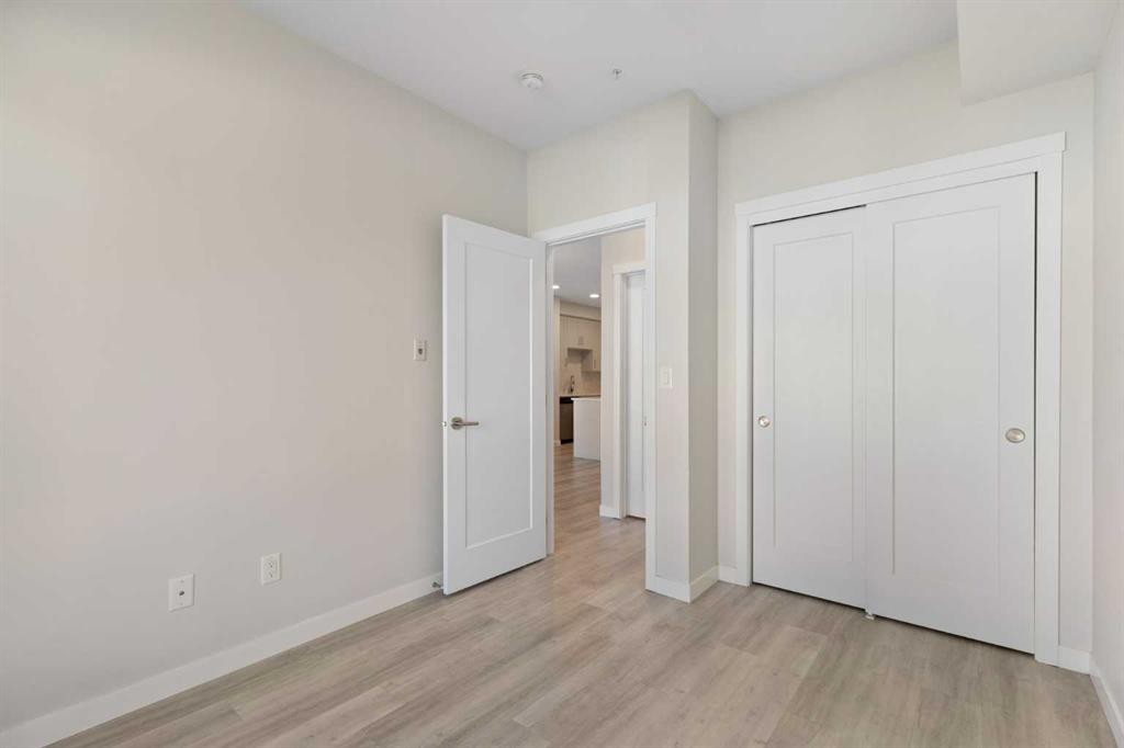 202-150 Shawnee Square Sw, Calgary, AB - Indoor Photo Showing Other Room