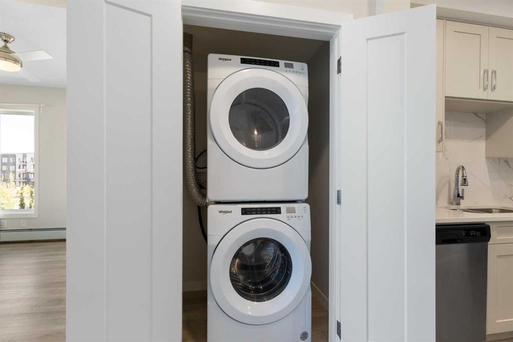 202-150 Shawnee Square Sw, Calgary, AB - Indoor Photo Showing Laundry Room