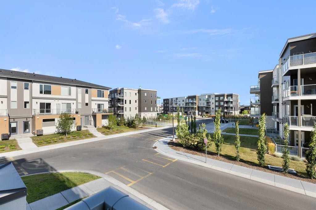 202-150 Shawnee Square Sw, Calgary, AB - Outdoor With Balcony