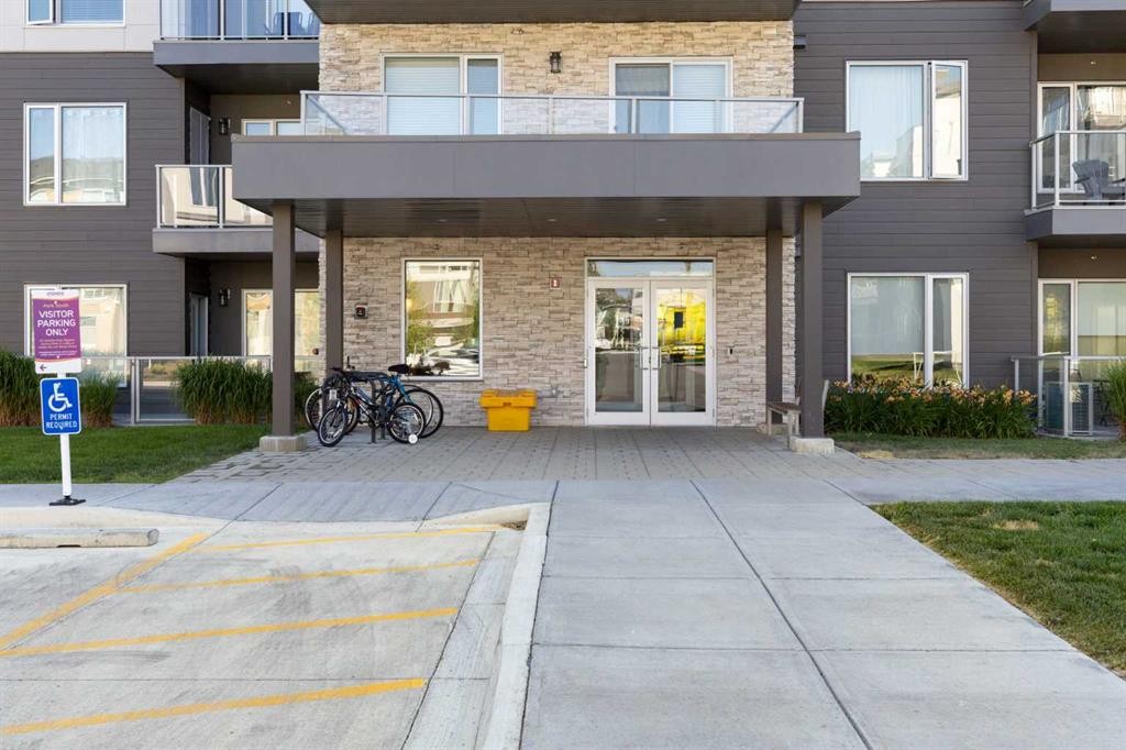 202-150 Shawnee Square Sw, Calgary, AB - Outdoor With Balcony With Facade