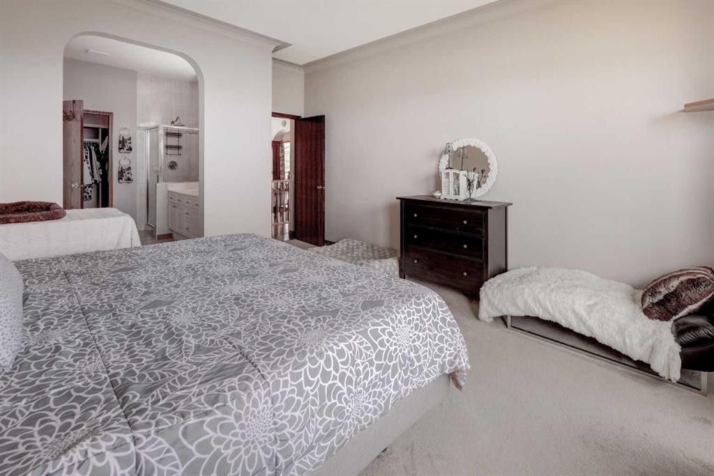 321 Gleneagles View, Cochrane, AB - Indoor Photo Showing Bedroom