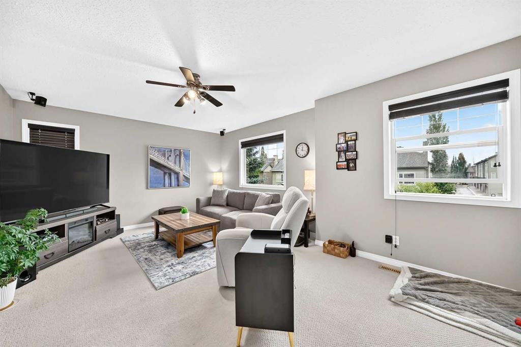 121 Chapalina Heights Se, Calgary, AB - Indoor Photo Showing Living Room