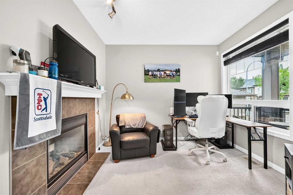 121 Chapalina Heights Se, Calgary, AB - Indoor With Fireplace