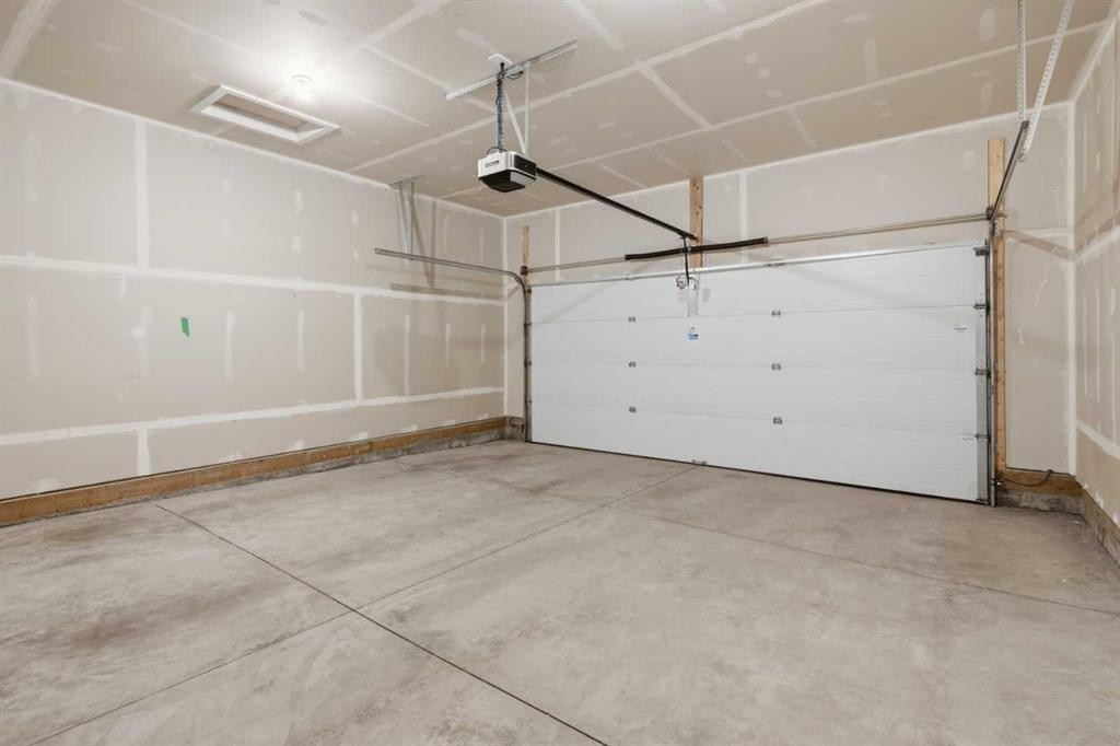 199 Carringham Road Nw, Calgary, AB - Indoor Photo Showing Garage