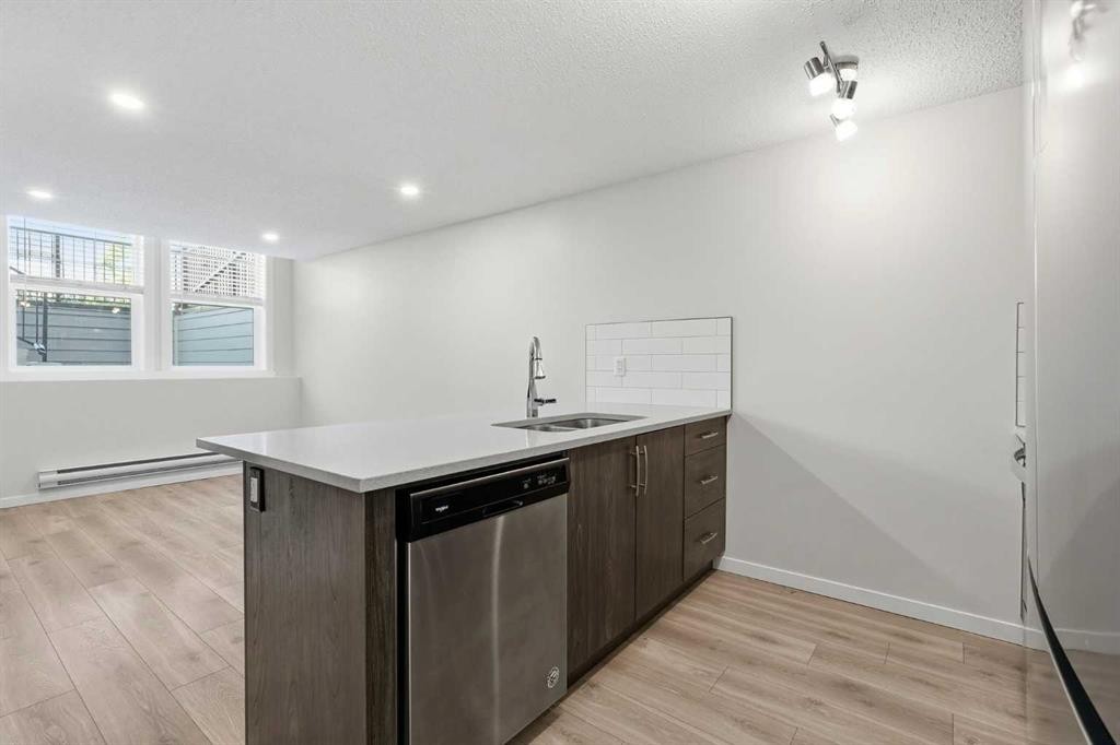 124 Cranbrook Square Se, Calgary, AB - Indoor Photo Showing Kitchen With Double Sink