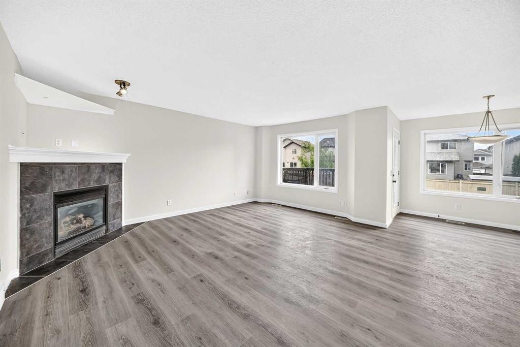 531 Stonegate Road Nw, Airdrie, AB - Indoor Photo Showing Living Room With Fireplace