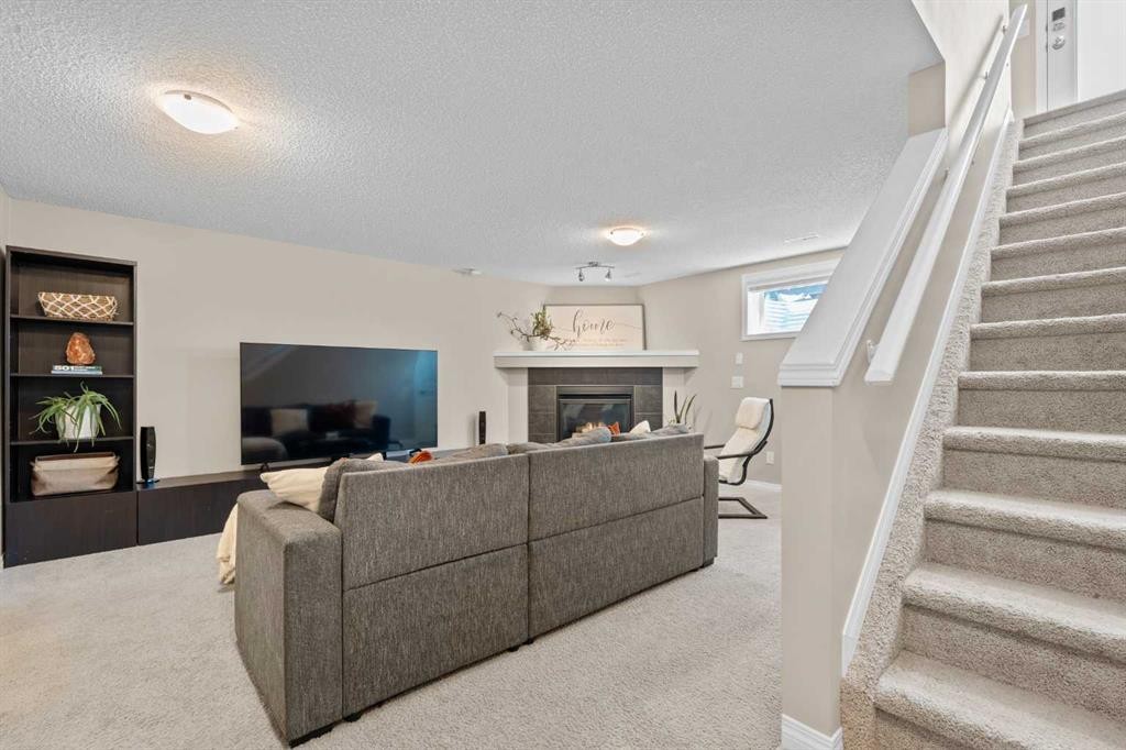 38 Auburn Bay Gardens Se, Calgary, AB - Indoor With Fireplace