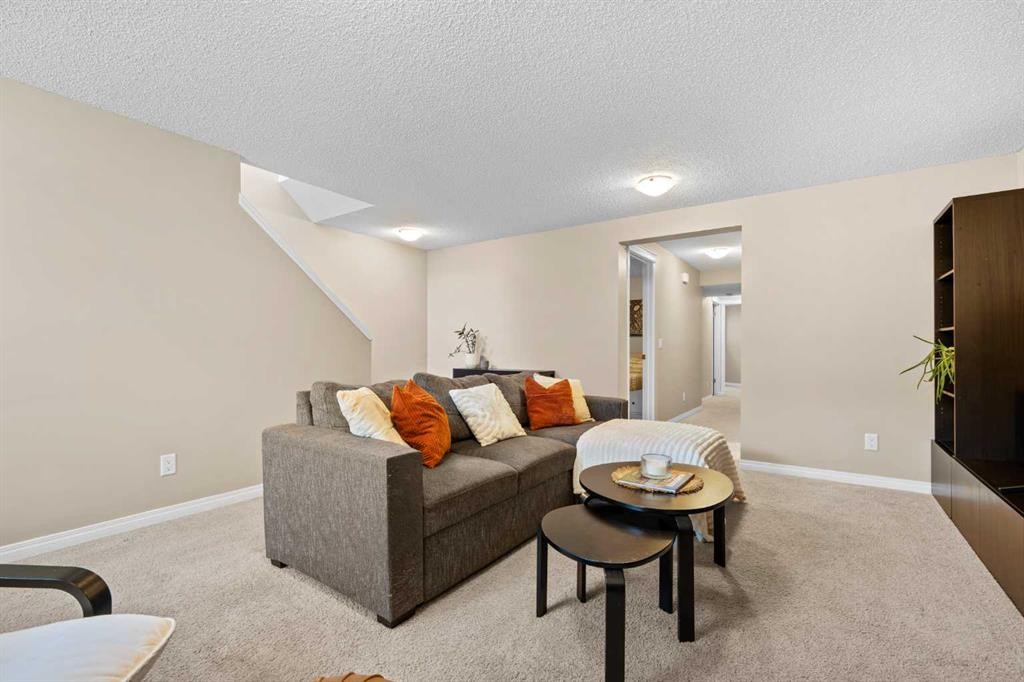 38 Auburn Bay Gardens Se, Calgary, AB - Indoor Photo Showing Living Room