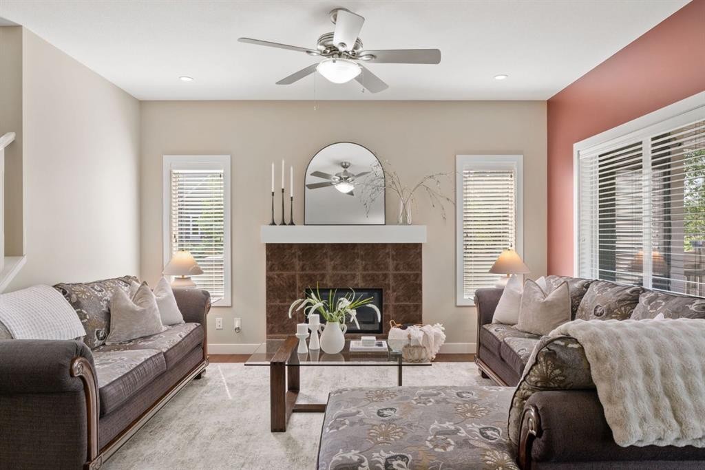 25 Masters Park Se, Calgary, AB - Indoor Photo Showing Living Room With Fireplace
