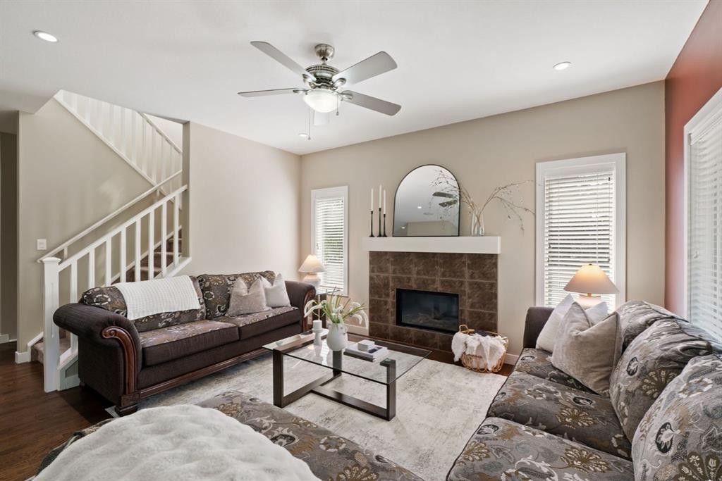 25 Masters Park Se, Calgary, AB - Indoor Photo Showing Living Room With Fireplace