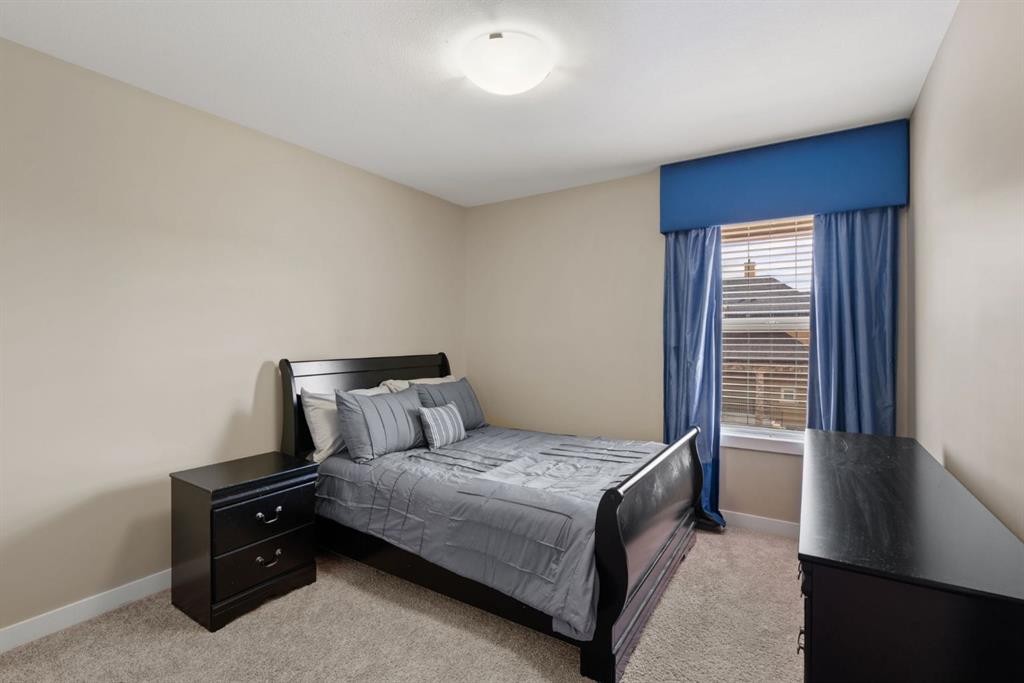 25 Masters Park Se, Calgary, AB - Indoor Photo Showing Bedroom