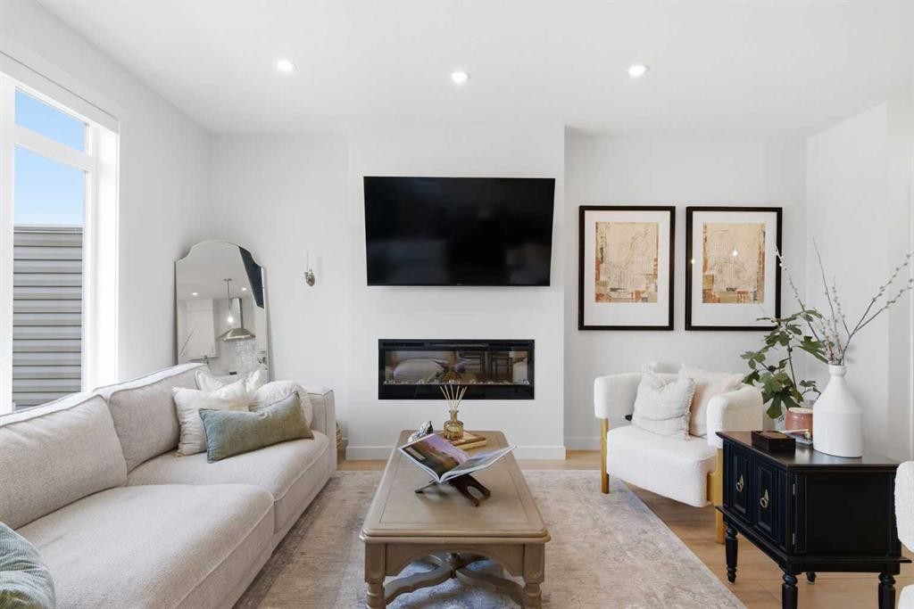 31 Seton Row Se, Calgary, AB - Indoor Photo Showing Living Room With Fireplace