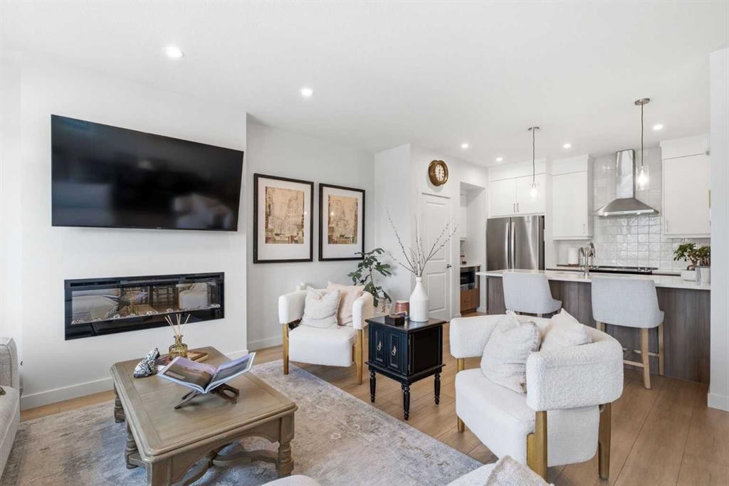 31 Seton Row Se, Calgary, AB - Indoor Photo Showing Living Room With Fireplace