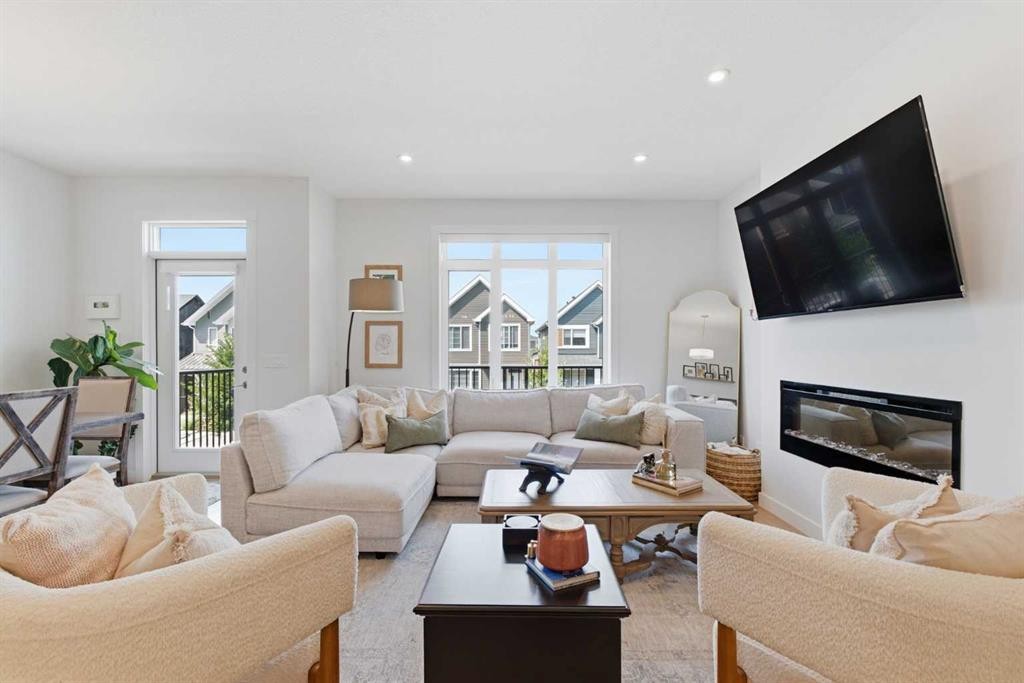 31 Seton Row Se, Calgary, AB - Indoor Photo Showing Living Room With Fireplace