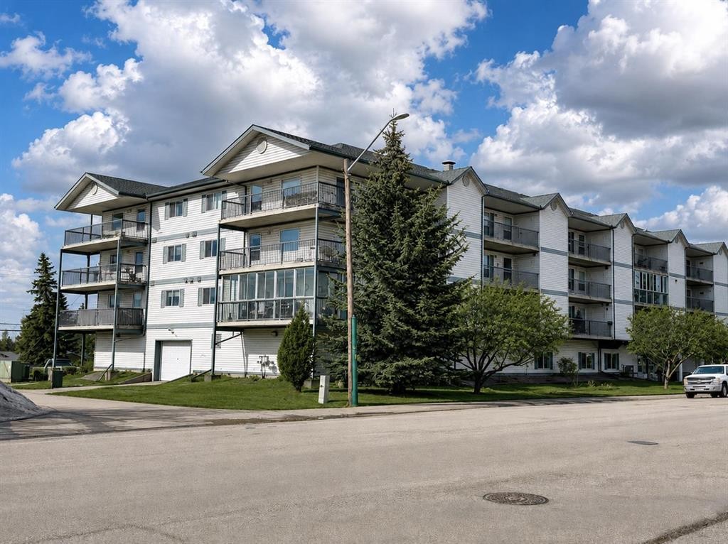 301-4514 54 Avenue, Olds, AB - Outdoor With Balcony With Facade