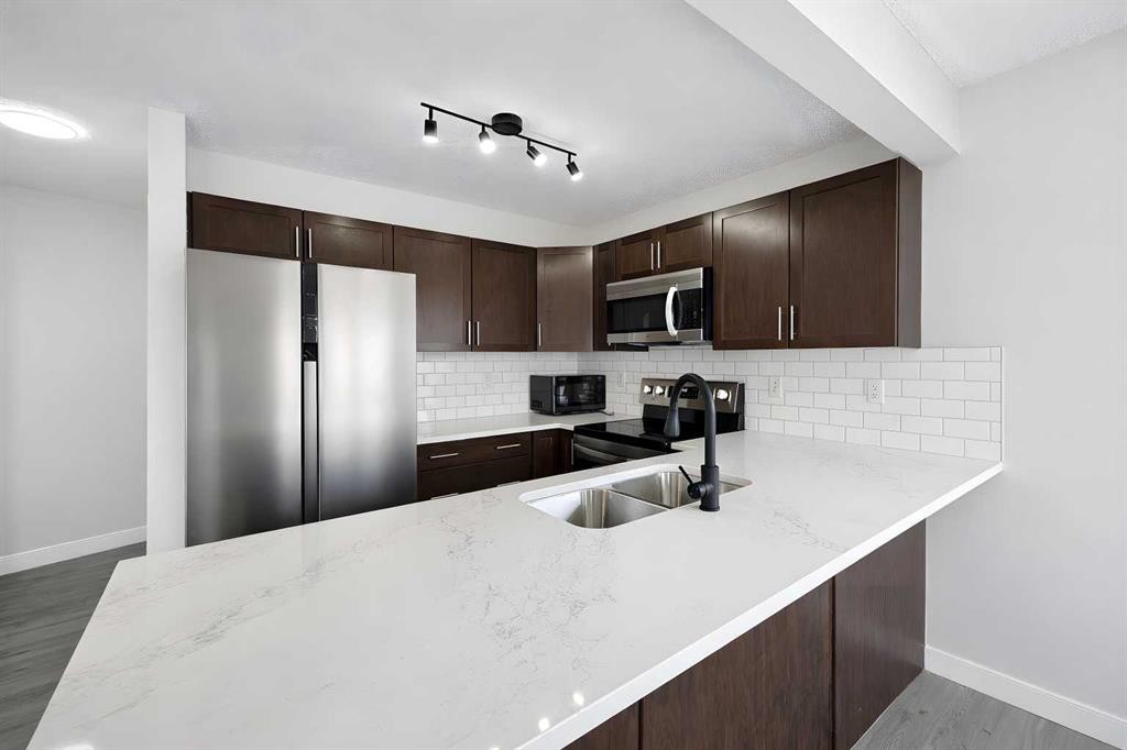 137 Pantego Lane Nw, Calgary, AB - Indoor Photo Showing Kitchen With Stainless Steel Kitchen With Double Sink With Upgraded Kitchen