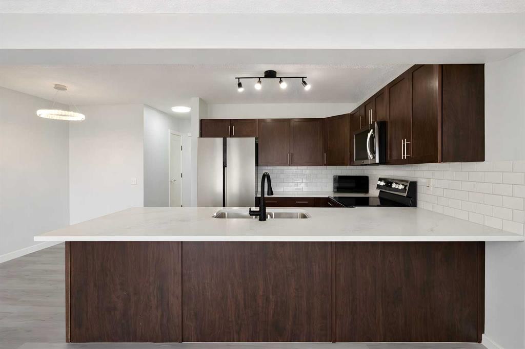 137 Pantego Lane Nw, Calgary, AB - Indoor Photo Showing Kitchen With Double Sink