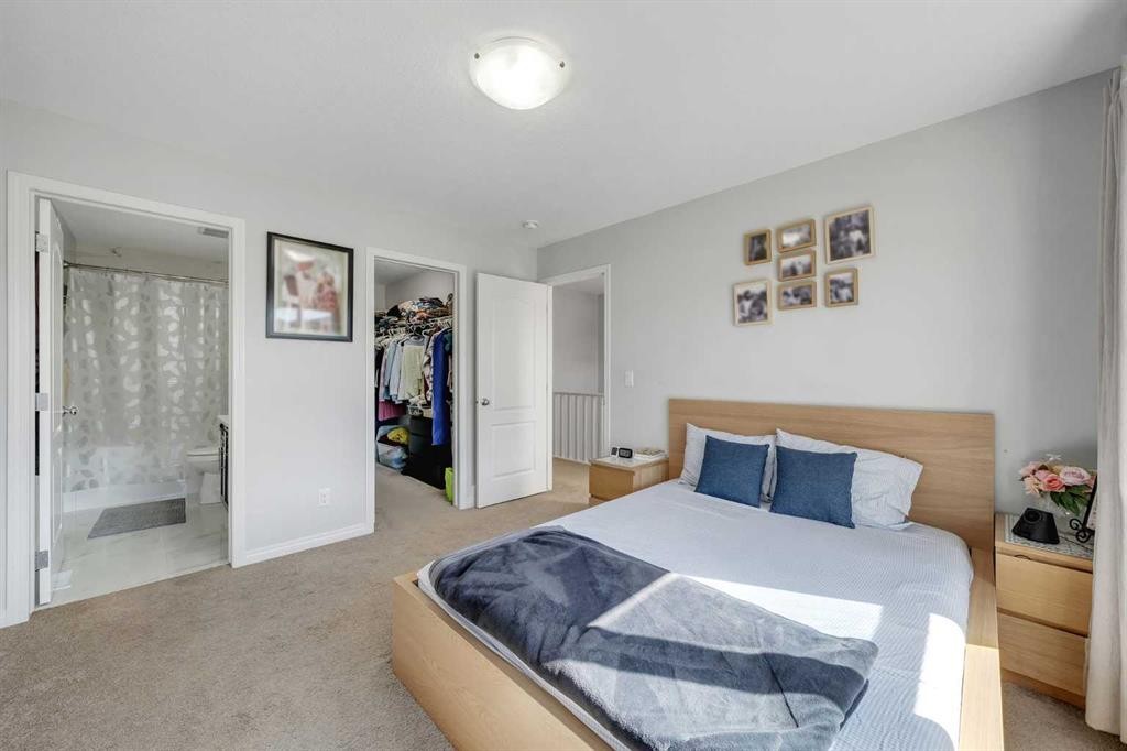 143 Dawson Harbour Hill, Chestermere, AB - Indoor Photo Showing Bedroom