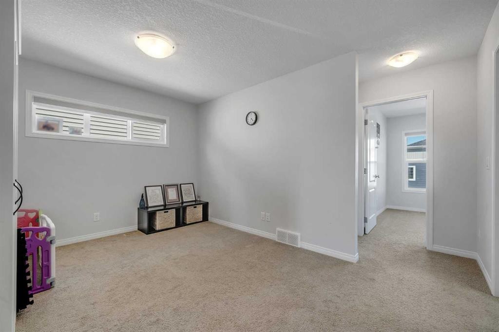 143 Dawson Harbour Hill, Chestermere, AB - Indoor Photo Showing Other Room