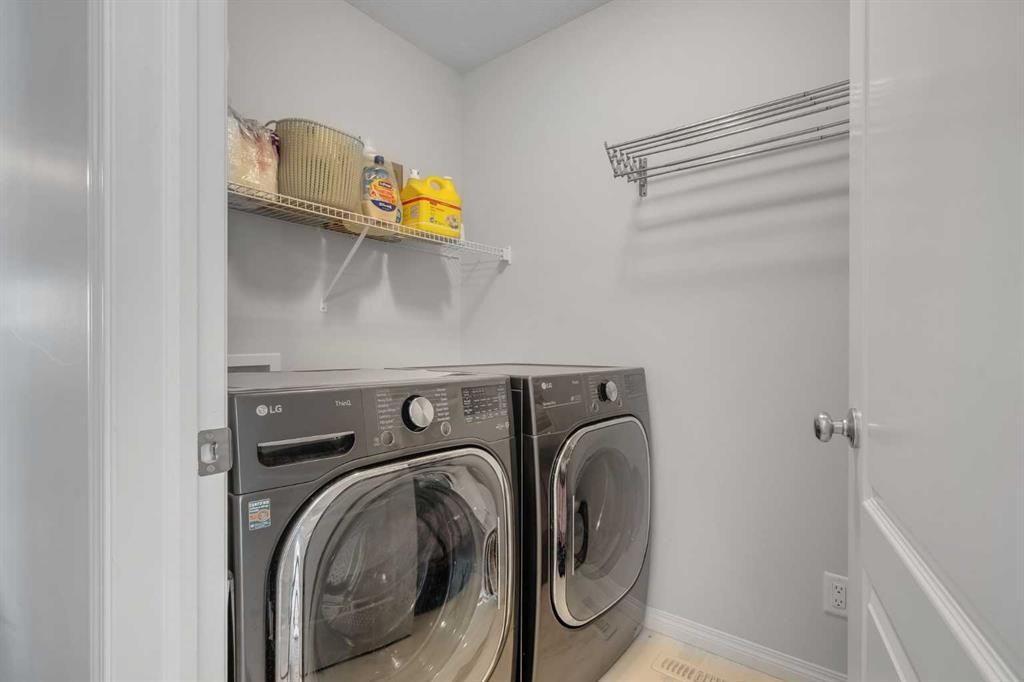 143 Dawson Harbour Hill, Chestermere, AB - Indoor Photo Showing Laundry Room