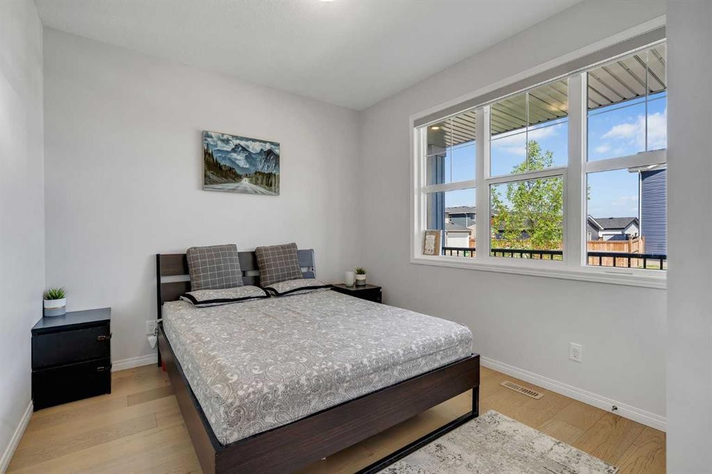 143 Dawson Harbour Hill, Chestermere, AB - Indoor Photo Showing Bedroom
