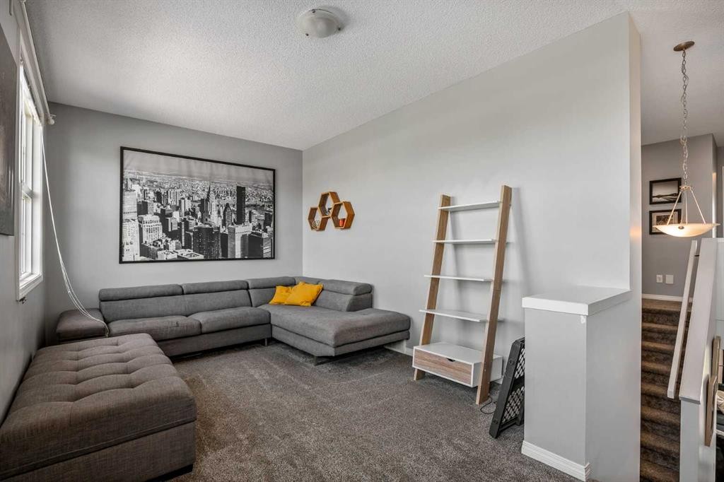 5 Copperpond Link Se, Calgary, AB - Indoor Photo Showing Living Room