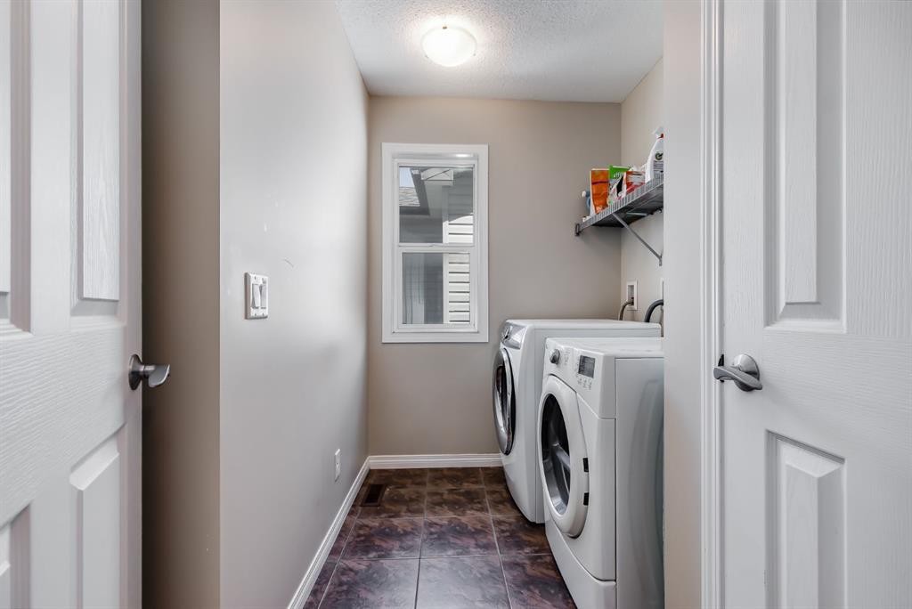 54 Autumn View Se, Calgary, AB - Indoor Photo Showing Laundry Room