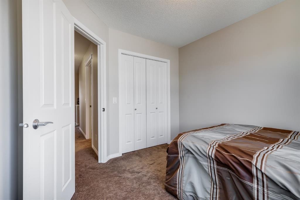 54 Autumn View Se, Calgary, AB - Indoor Photo Showing Bedroom