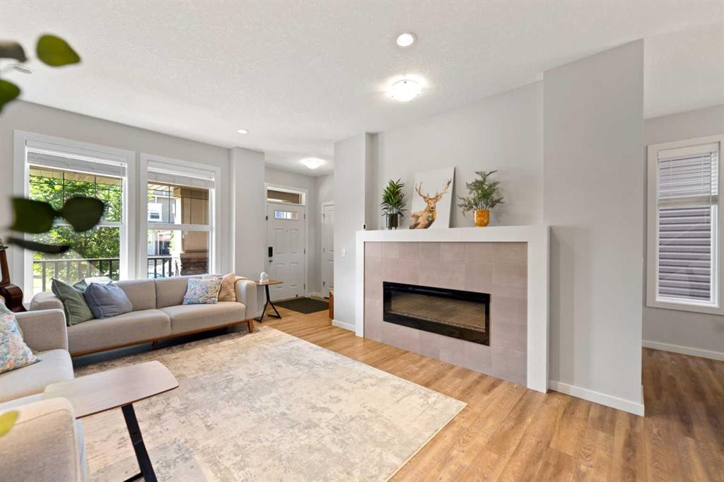 79 Legacy Glen Row Se, Calgary, AB - Indoor Photo Showing Living Room With Fireplace