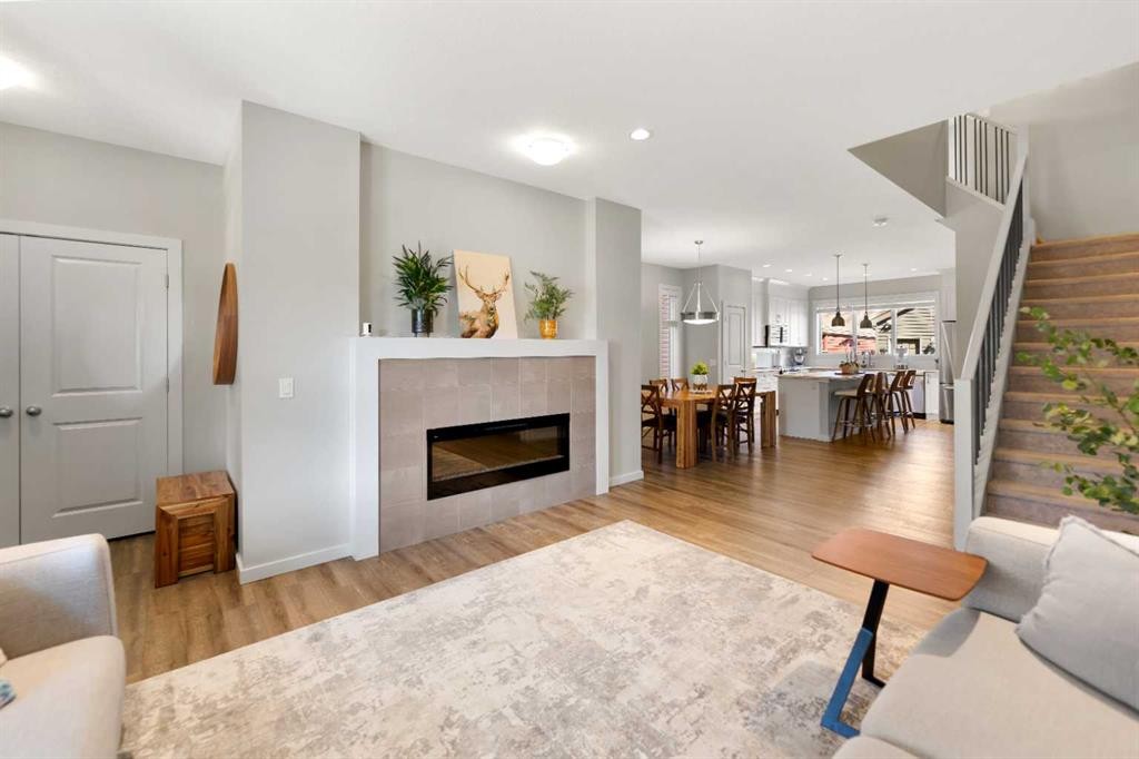 79 Legacy Glen Row Se, Calgary, AB - Indoor Photo Showing Living Room With Fireplace