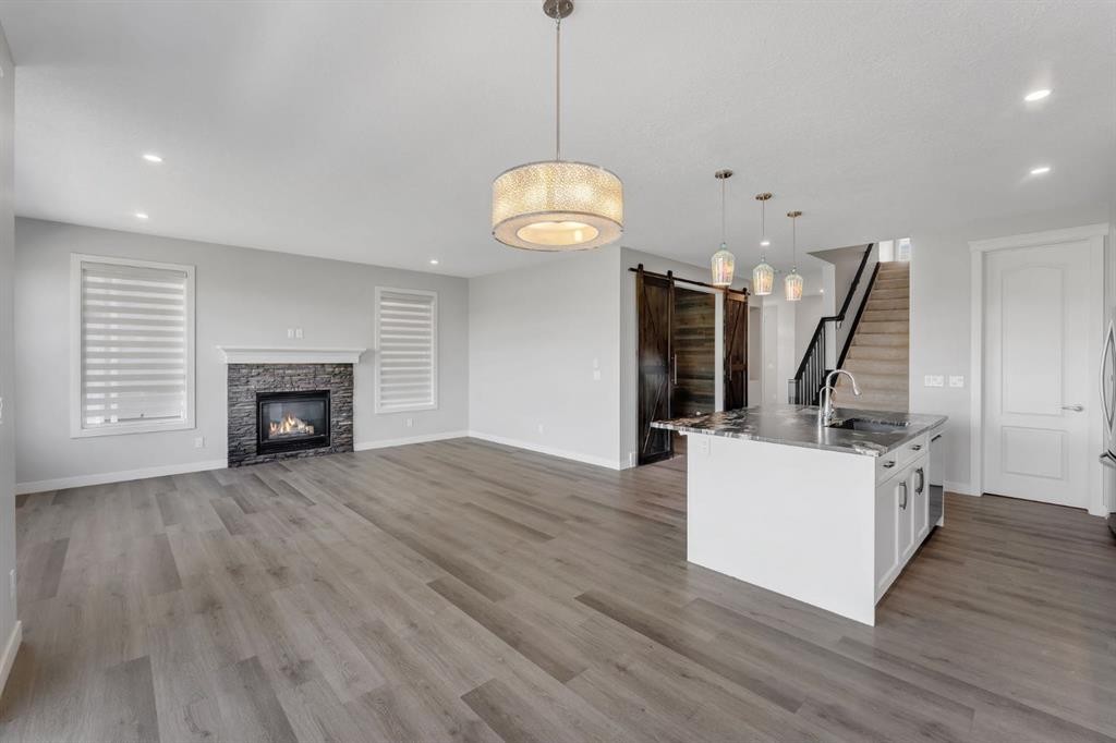 40 Evansfield Manor Nw, Calgary, AB - Indoor Photo Showing Other Room With Fireplace