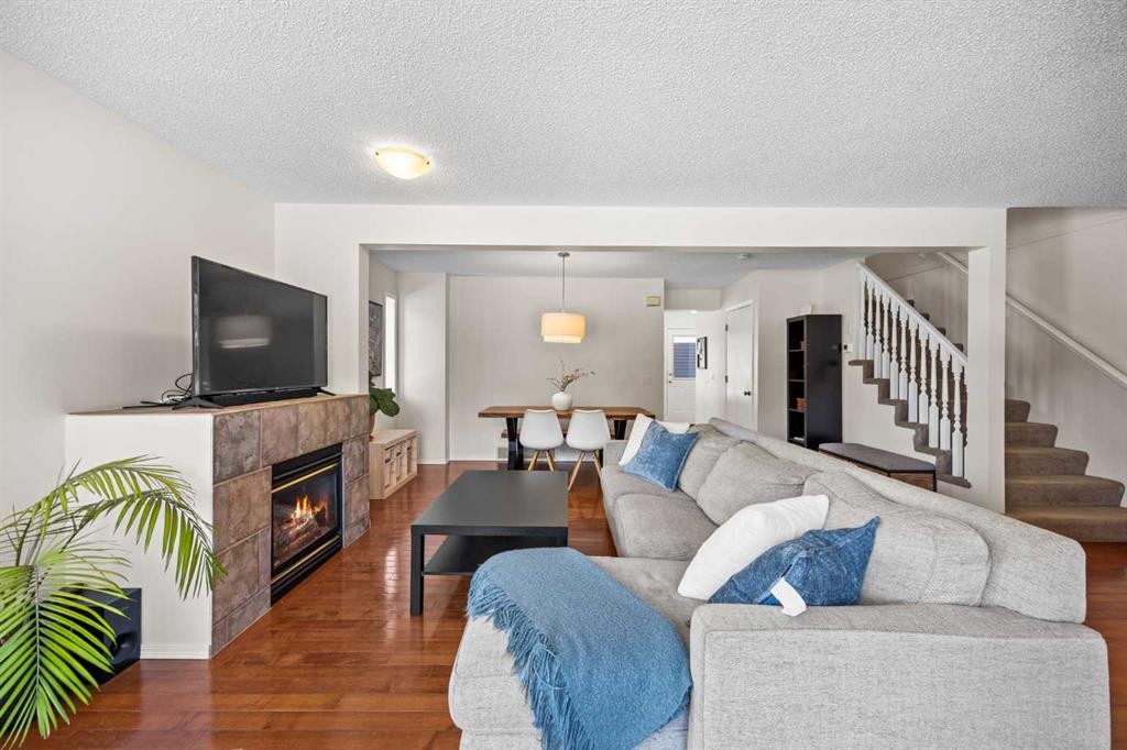 690 Regal Park Ne, Calgary, AB - Indoor Photo Showing Living Room With Fireplace