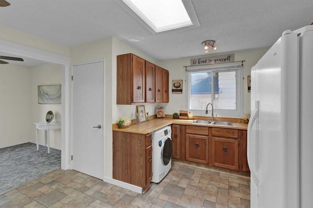 27 Bedridge Way Ne, Calgary, AB - Indoor Photo Showing Kitchen With Double Sink