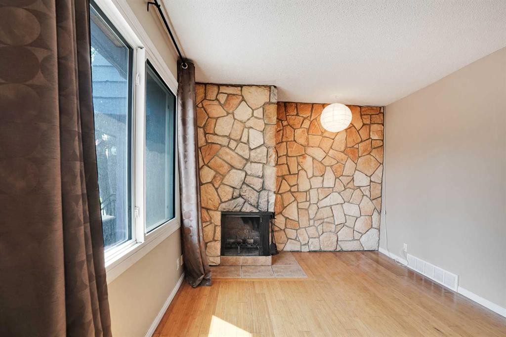 6-6404 4A Street Ne, Calgary, AB - Indoor With Fireplace
