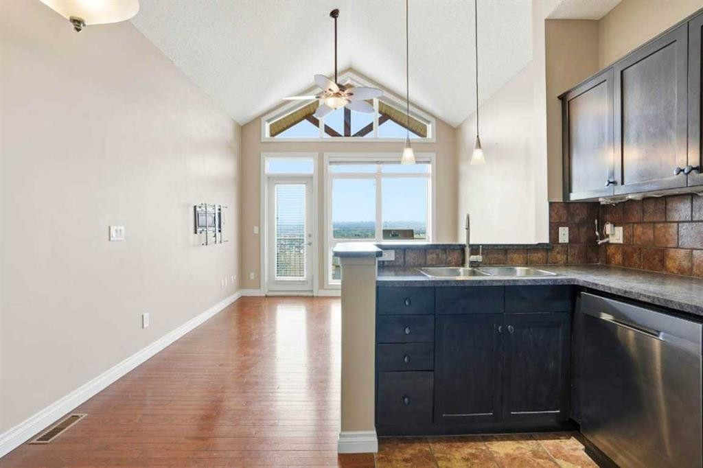 11-148 Rockyledge View Nw, Calgary, AB - Indoor Photo Showing Kitchen With Double Sink